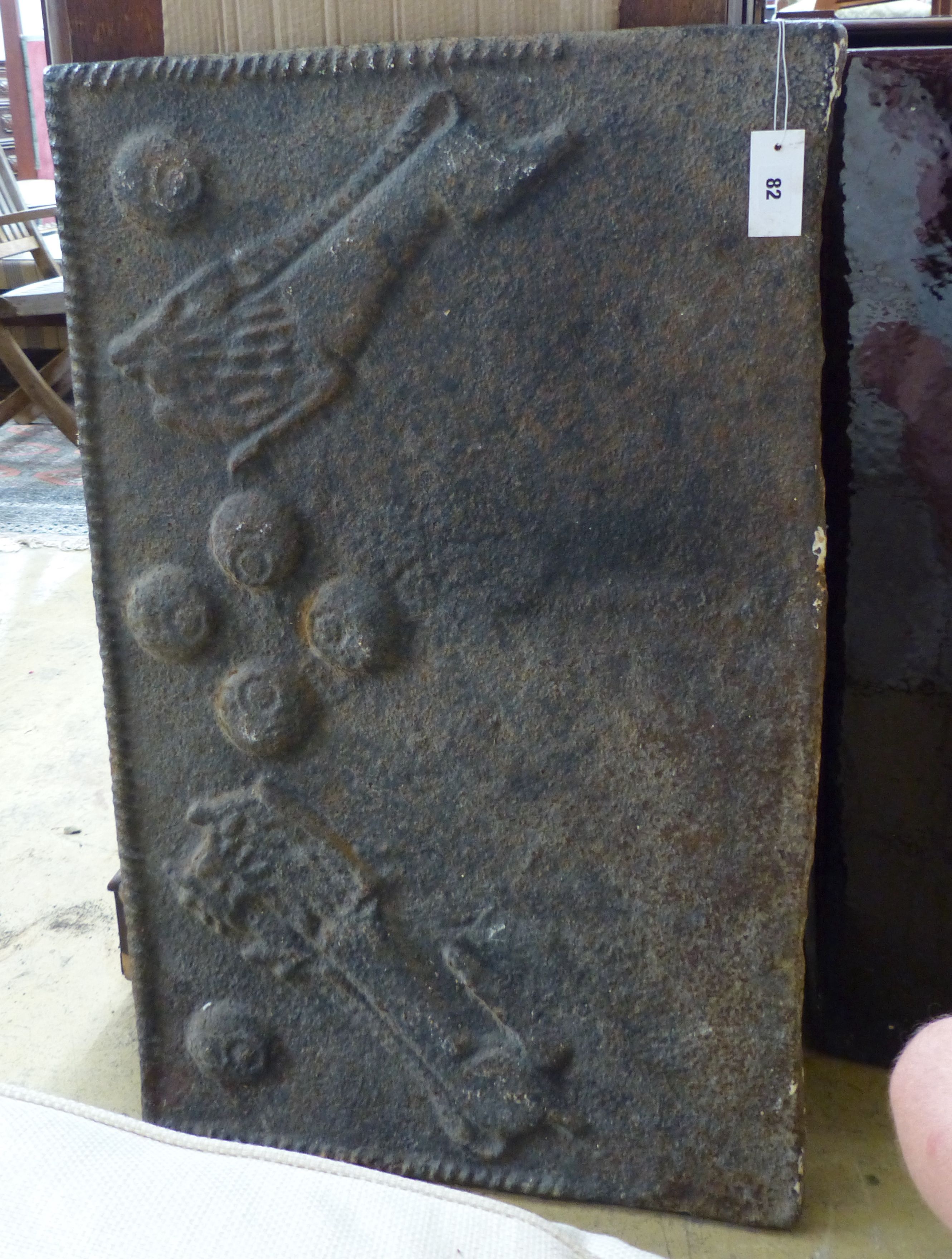 A cast iron fireback, width 59cm, height 93cm